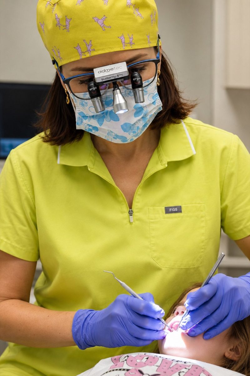 Dentist treating a child at Genesis Dental Centre